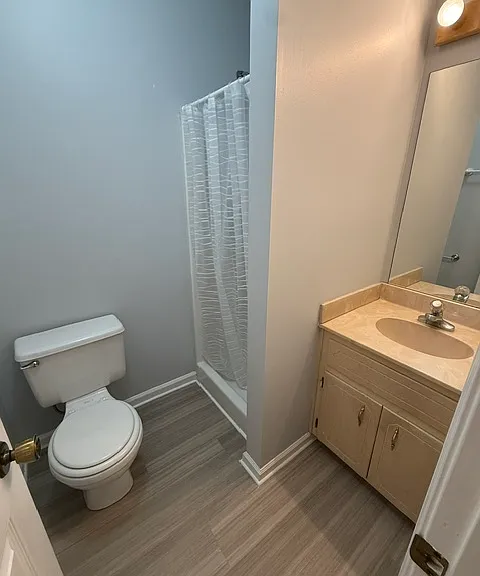 Back bedroom bathroom that now has new toilet and sink faucet