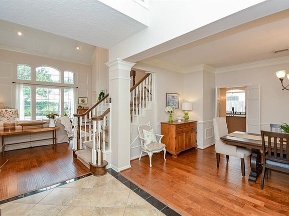 Entering into this spectacular home, the tone is set for the rest of the home. To the right is the formal dining and straight ahead is one of 2 Family Rooms.