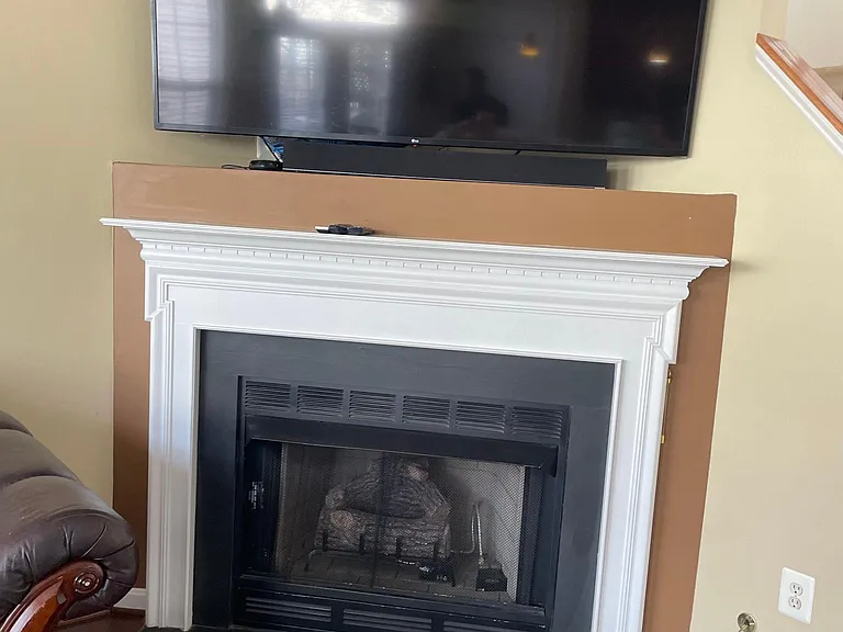 Fireplace and Family room sitting area with TV mount that will stay for next Tenant to use.