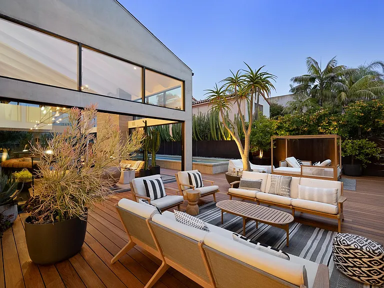 Enjoy a glass of champagne as you watch the sunset from the outdoor lounge.