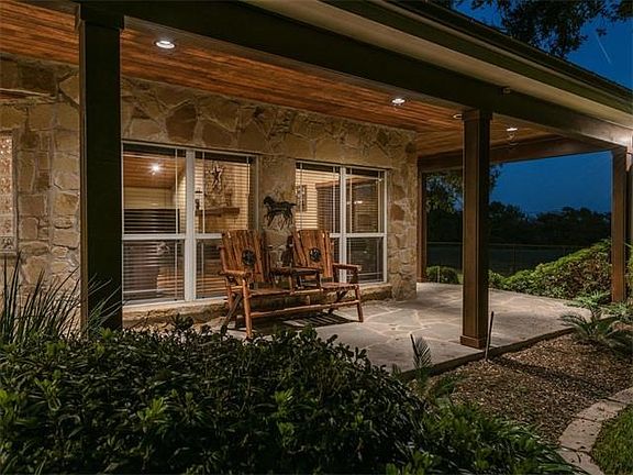 View of the cozy yet airy porch. Beautiful windows bring in natural light from outdoors.