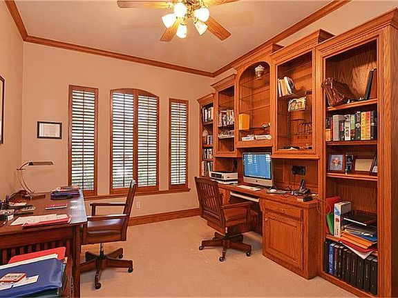The study is perfect with gorgeous built ins, windows to the front, and it is separated from the main living areas.