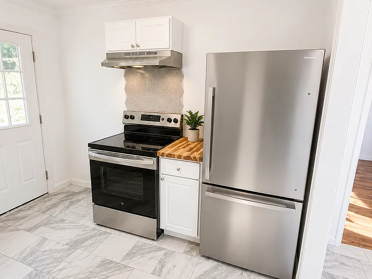 New stainless steel appliances, cabinets, tile flooring, and counter tops. 

Photo Note: Photos have been lightly enhanced to improve lighting and image quality. Colors, finishes, and exterior conditions may vary slightly during in-person viewing.