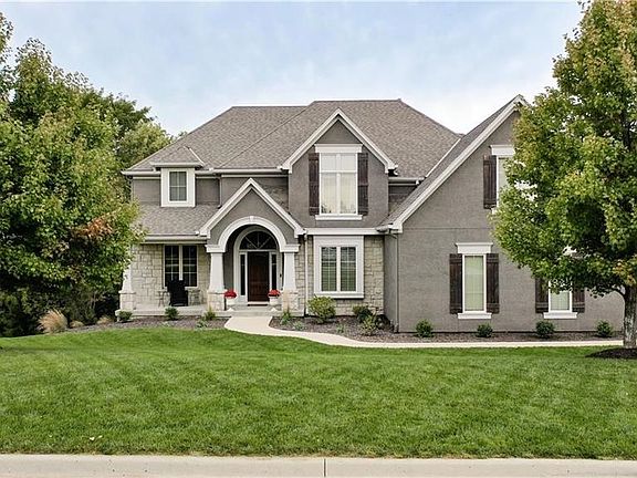 Exceptional 2 Story home on over 1/2 acre mature treed lot with side entry 3 car garage.