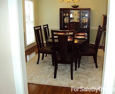 Formal Dining Room
						:
						Looks out towards first tee box and the club house.