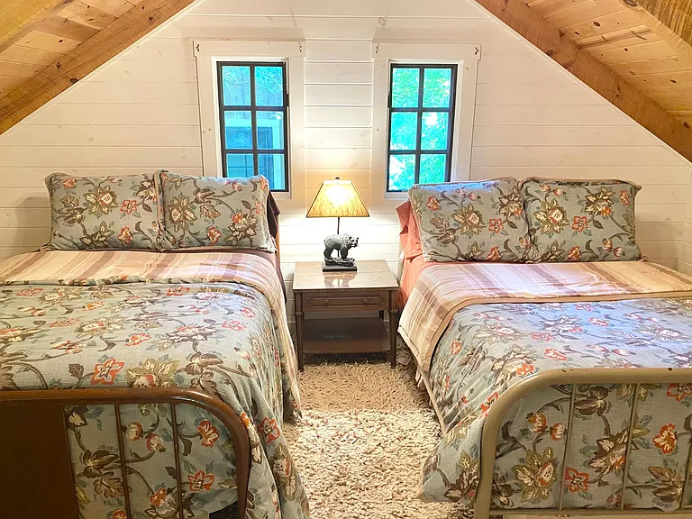 Bonus upstairs loft features two double beds.