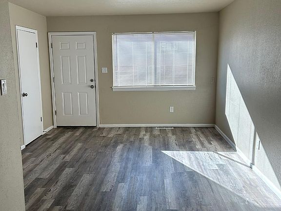 View of Living area and front door. On the left is a big size storage closet