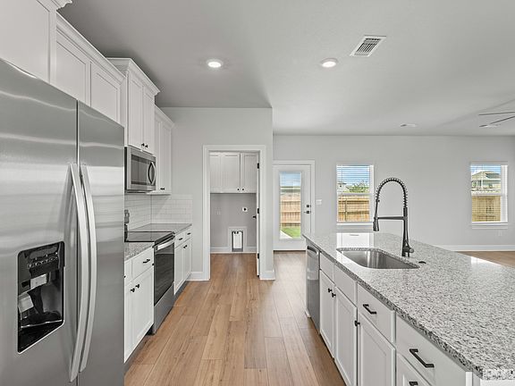 The kitchen has energy-efficient appliances.