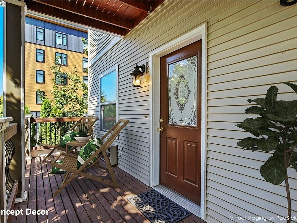 Front door with deck concept chairs and table.