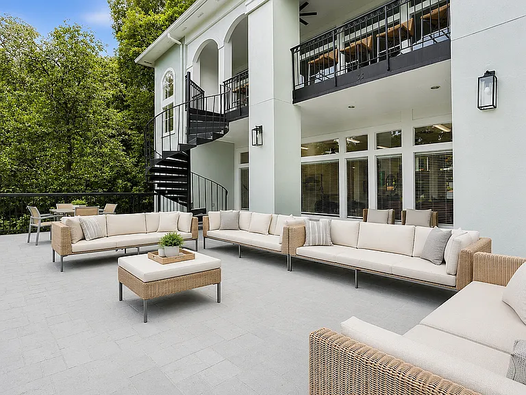 Experience luxury outdoor living with views of the Chattahoochee River and lush landscaping.