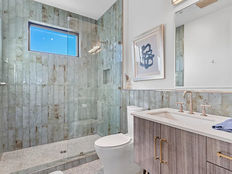 This gorgeous modern bathroom features Italian tile.