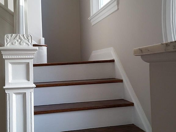 Double staircase with steps leading to kitchen