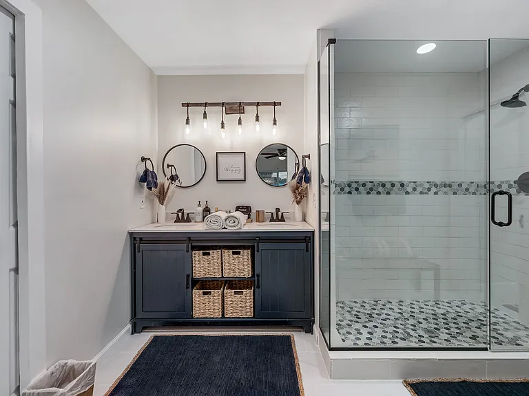 Ensuite to Bedroom #3. Dual sink vanity, walk-in shower, separate toilet