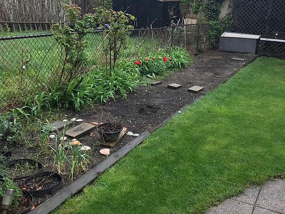 Large backyard complete with composter and AMAZING soil for all of your veggie growing