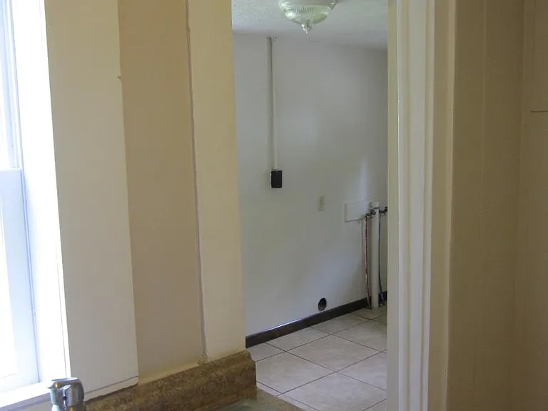 Kitchen looking into laundry room