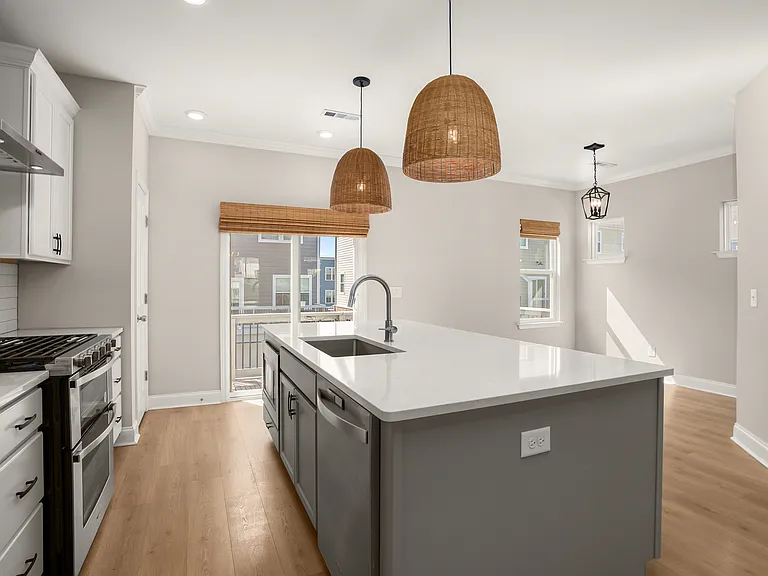 Very nice quartz counter tops in this lovely kitchen