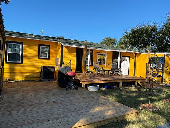 Rear view of home with deck.
