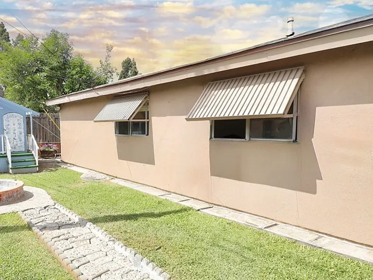 Backyard with kids playhouse
