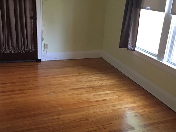 Bedroom 1 with doorway to sun porch