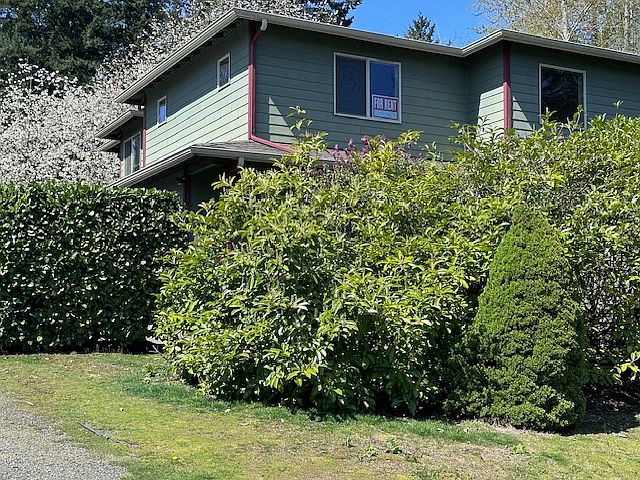 View of East side of building and Unit A as drive up.