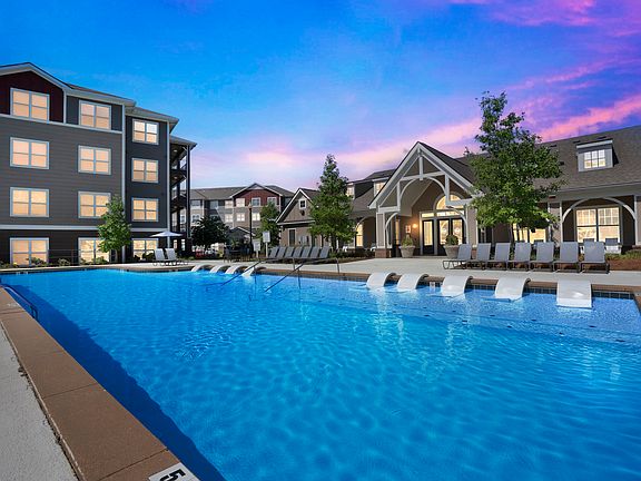 Relax by the resort-style pool and enjoy the luxurious clubhouse amenities at The Flatts Starkville.
