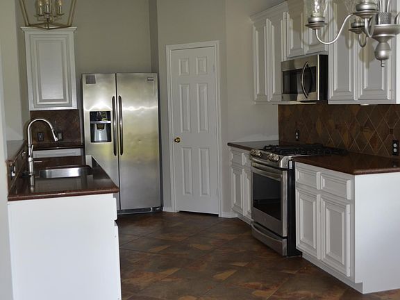 View of the kitchen from the breakfast room that offers a lot of natural light.