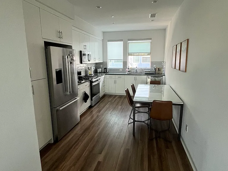 Dining room with fridge and dining table