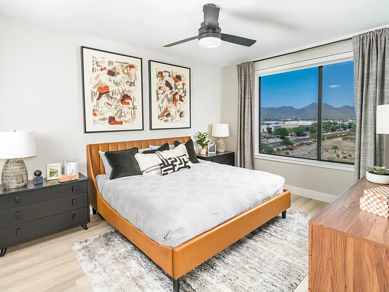 A spacious bedroom retreat with warm textures and modern finishes designed for ultimate comfort and style.