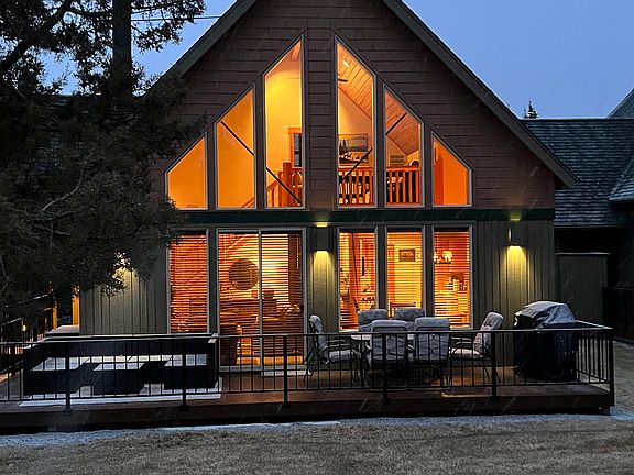 Back Porch Which Backs Up To Golf Course. Gas Grill & Seating For Relaxing