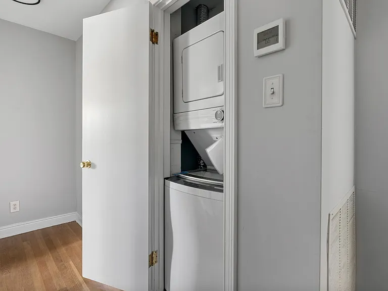 Common - stacked laundry washer & dryer in hallway on 2nd level