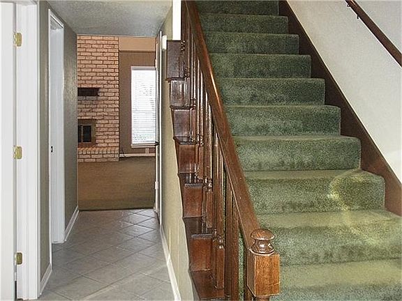 From foyer..stairs leading upstairs.