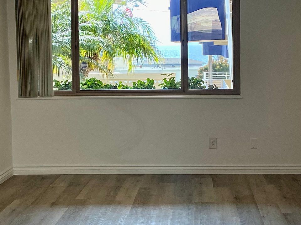 Ocean and garden view living room in this open floor plan entertainers delight