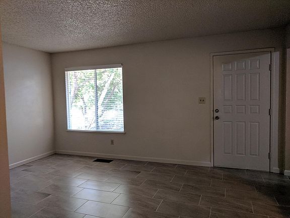 Living Room and Front Door. Tiled floors.