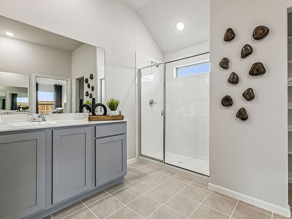 Primary Bathroom in the Turquoise home plan by Trophy Signature Homes - REPRESENTATIVE PHOTO
