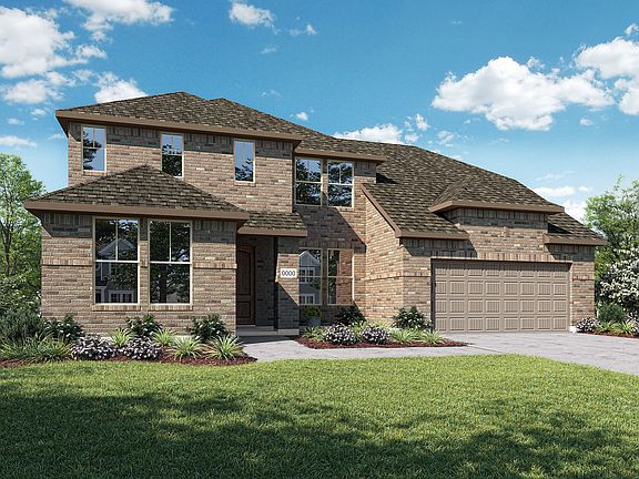 A two-story brick house with a tiled roof sits on a well-manicured lawn, surrounded by lush greenery