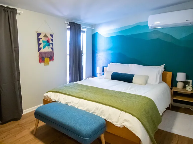 1st bedroom with mountain mural, and AC/Heating above bed.