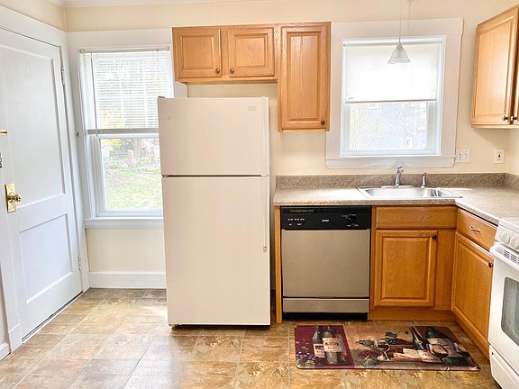Kitchen includes a door leading to the nicely landscaped yard with space for a grill, patio set and more!