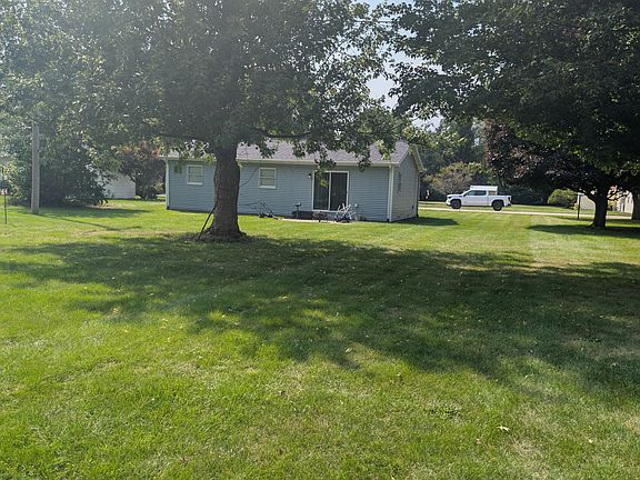 back yard looking at house and patio