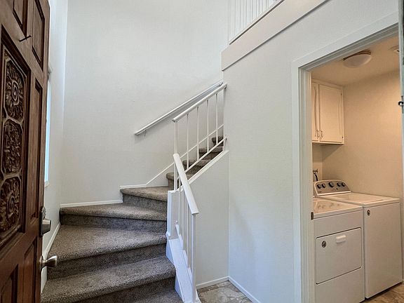 Foyer with washer + dryer room