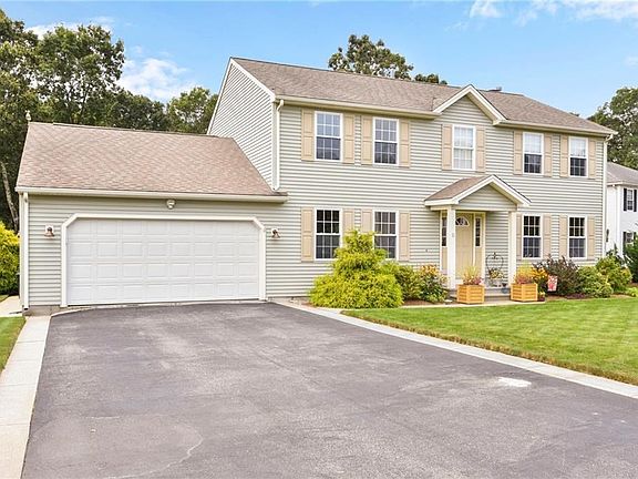 Paved driveway with a large 2-car garage.