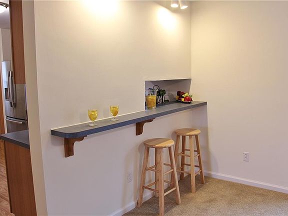 Pull up a stool and entertain with ease in the flex room--perfect as either a dining room or a den.