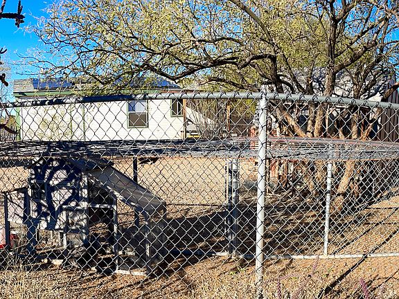 Outside the backyard fence. The chickens are temporarily housed in a run in the backyard while their big coop is built.