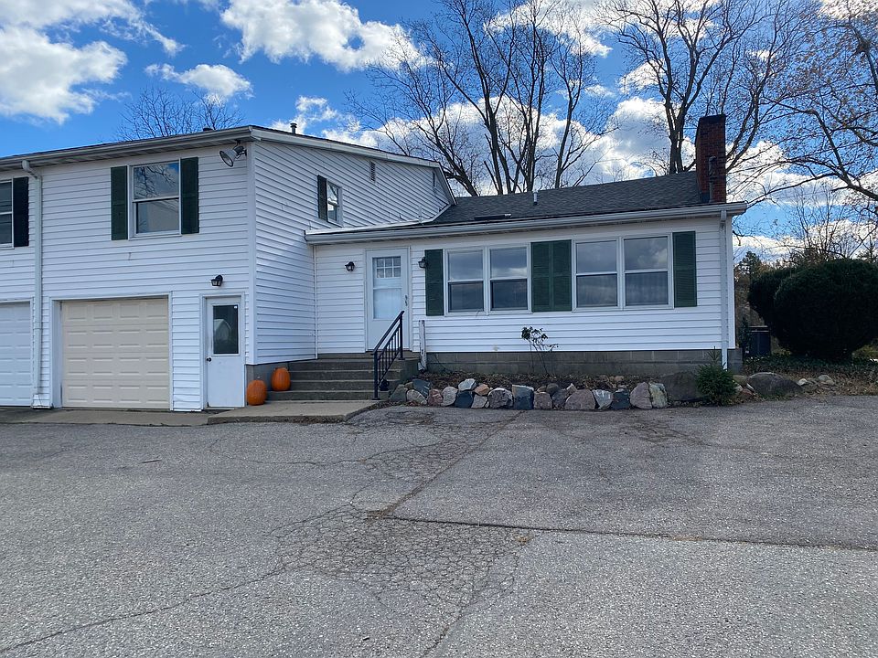 North entrance and attached garage stall
