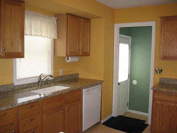 Oak cabinetry, granite countertops and Pergo flooring.