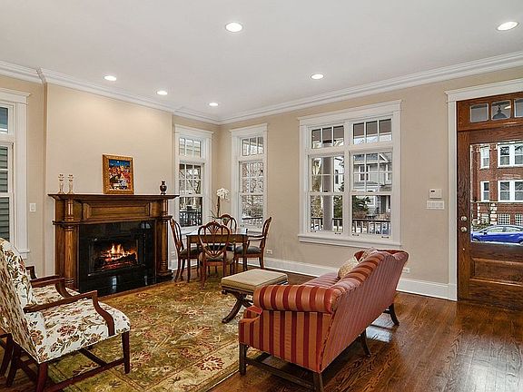 Formal living room with wood burning fireplace.