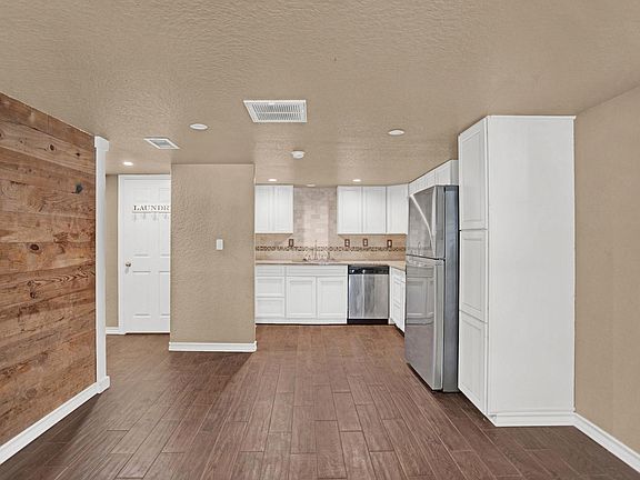 Dining and kitchen area, also washing room to the left