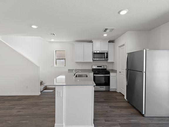 The kitchen of the Juniper is adjacent to the dining room.