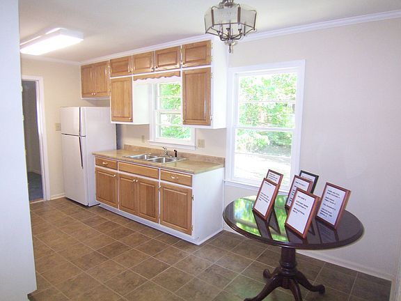 Eat-in kitchen with tile floor
