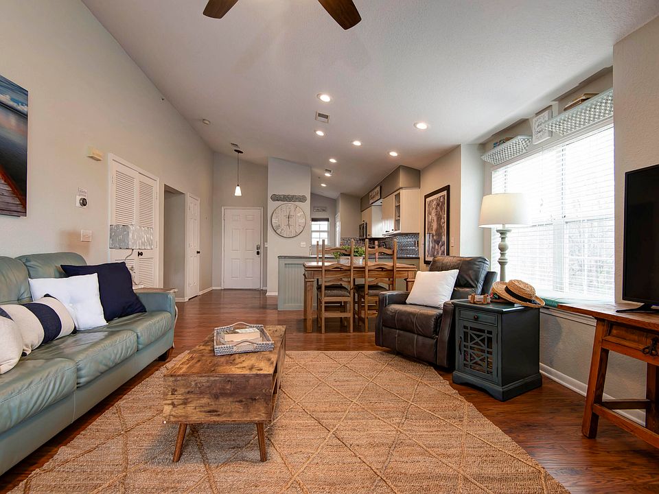 Living area with high ceilings, ceiling fans in all rooms
