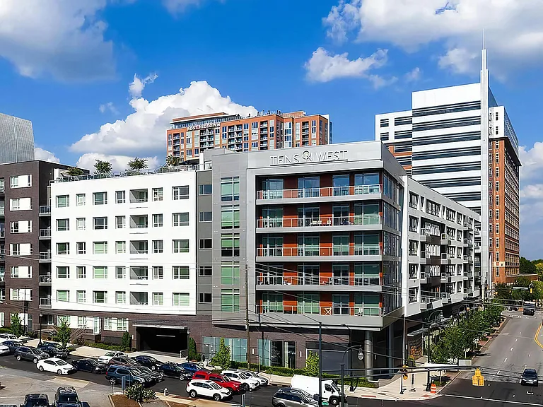 Corner View of Tens on West Apartments With Visible Signage